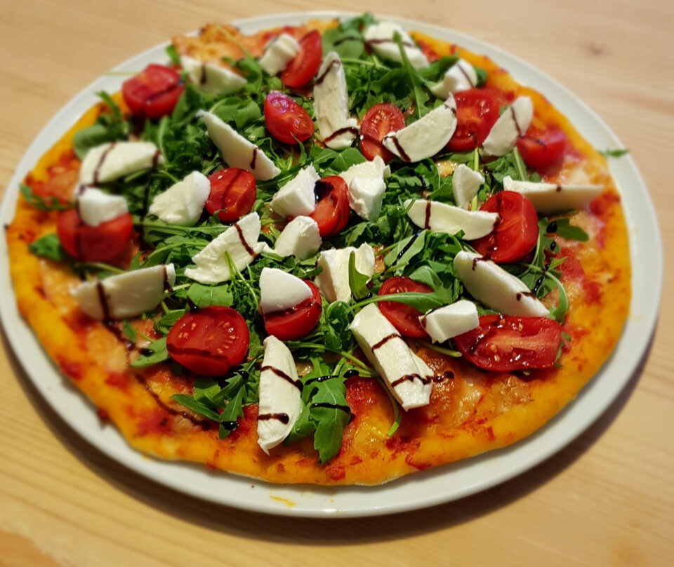 Pizza with Buffalo Mozzarella, Cherry Tomatoes, Arugula, Balsamic Vinegar of Modena DOP